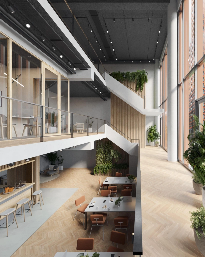 Modern ingerichte gemeenschappelijke ruimte aan het George Gershwinplein met hoge plafonds, veel daglicht en groenaccenten.